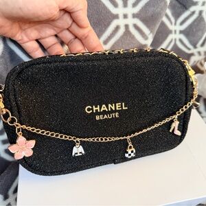 CHANEL Black Glitter Cosmetic Pouch with Gold Charm Chain and Pink Accents